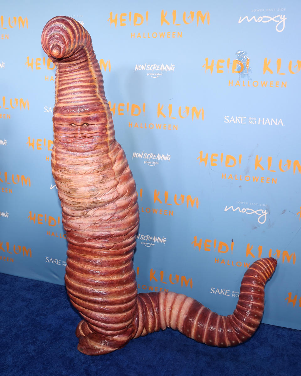 her in a large worm costume at an event