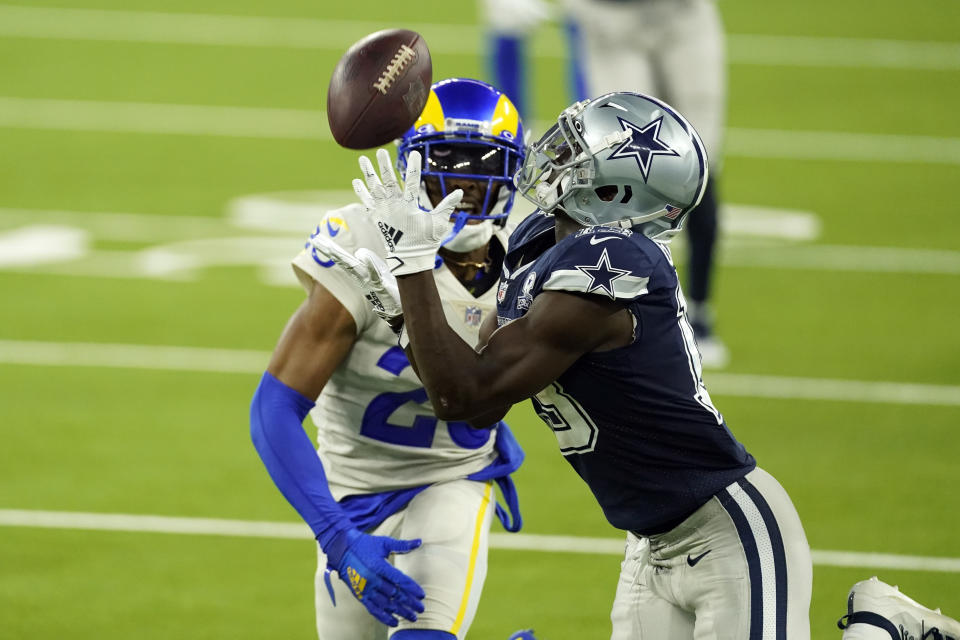 Dallas Cowboys wide receiver Michael Gallup, right, makes a catch but is called for offensive pass interference on Los Angeles Rams' Jalen Ramsey during the second half of an NFL football game Sunday, Sept. 13, 2020, in Inglewood, Calif. (AP Photo/Ashley Landis)