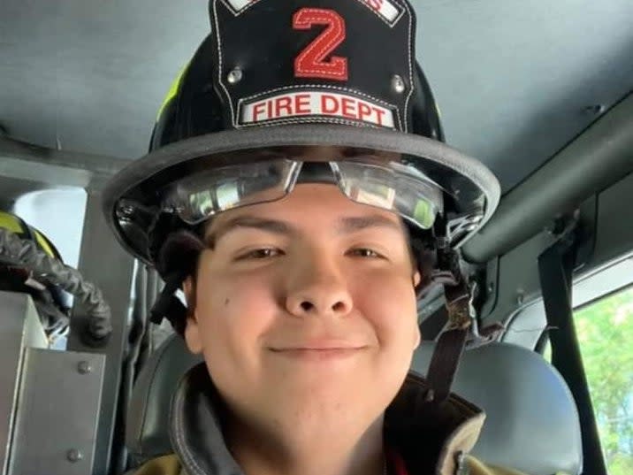 <p>Efren Medina in his uniform</p> ((St Mary’s Fire Department))