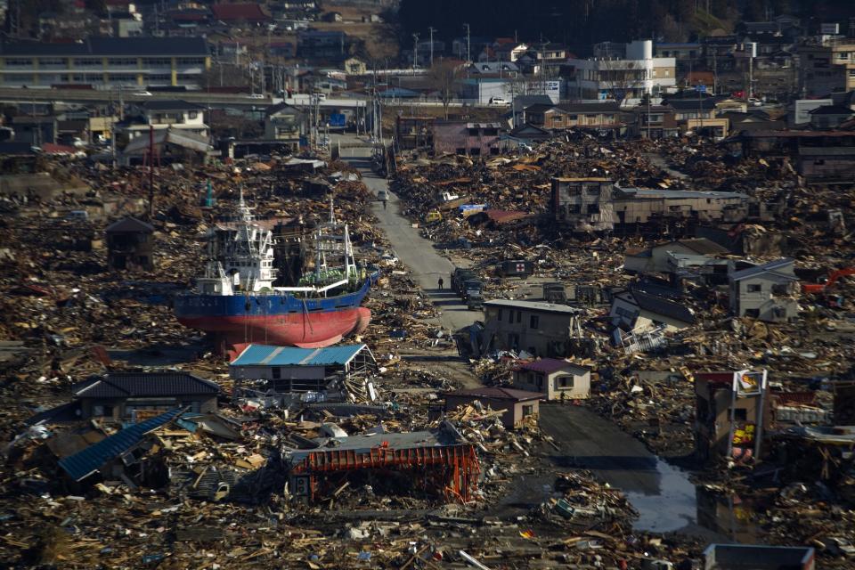 In this March 28, 2011, file photo, a ship sits in a destroyed residential neighborhood in Kesennuma, Miyagi Prefecture, northeastern Japan, after a powerful tsunami hit the area on March 11. (AP Photo/David Guttenfelder, File)