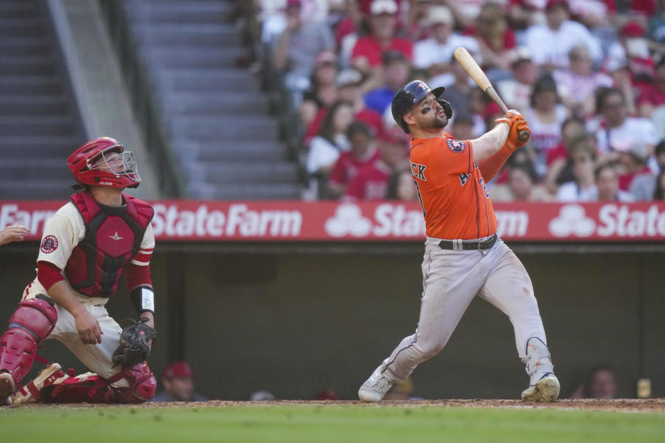 CORRECTS TEAM NAME - Houston Astros center fielder Chas McCormick hits a home run during the seventh inning of a baseball game against the Los Angeles Angels in Anaheim, Calif., Sunday, July 16, 2023. (AP Photo/Eric Thayer)