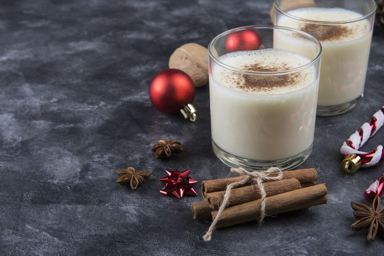 fresh eggnog with cinnamon with christmas decorations
