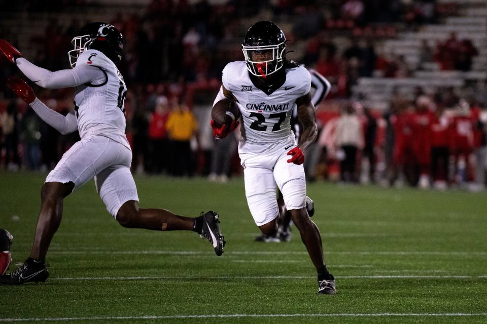 Cincinnati Bearcats safety Ken Willis (27) returns an interception to the 1-yard line in the fourth quarter in UC's Big 12 victory at Houston last Nov. 11.