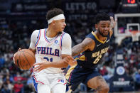 Philadelphia 76ers forward Seth Curry dribbles downcourt against New Orleans Pelicans guard Nickeil Alexander-Walker (6) in the first half of an NBA basketball game in New Orleans, Wednesday, Oct. 20, 2021. (AP Photo/Gerald Herbert)