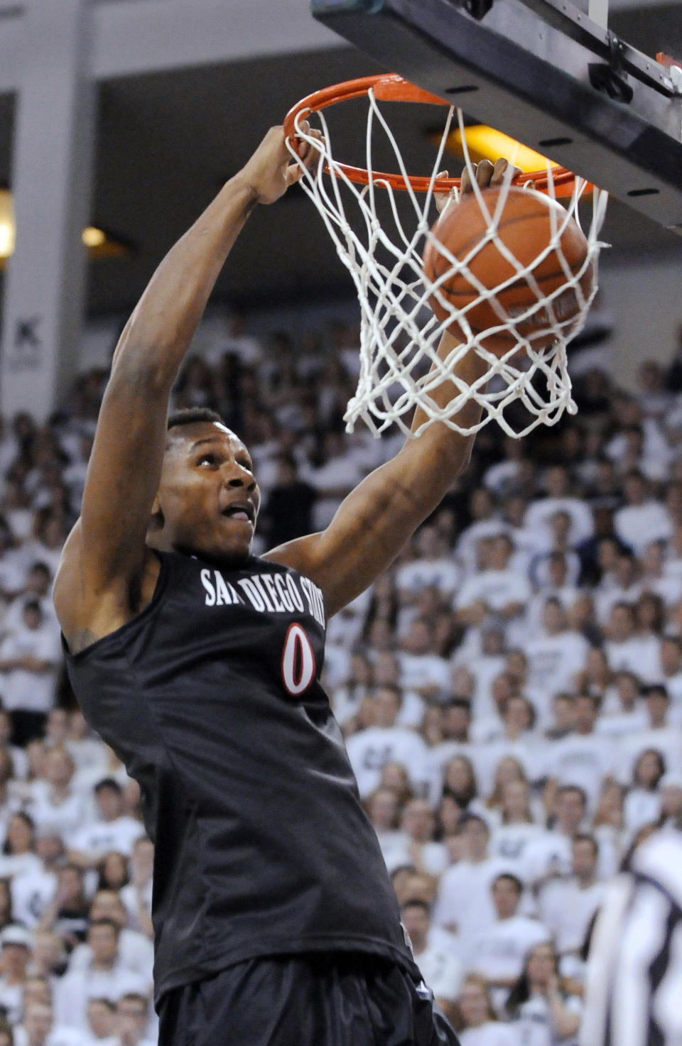 San Diego State forward Skylar Spencer dunks during the first half of an NCAA college basketball game against Utah State on Saturday, Jan. 25, 2014, in Logan, Utah. (AP Photo/Eli Lucero)