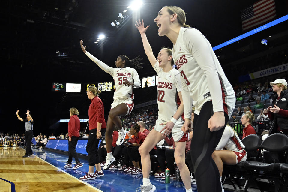 Washington State center Bella Murekatete (55), guard Kyra Gardner (12) and center Emma Nankervis (3) react after a play against California during the second half of an NCAA college basketball game in the first round of the Pac-12 women's tournament Wednesday, March 1, 2023, in Las Vegas. (AP Photo/David Becker)