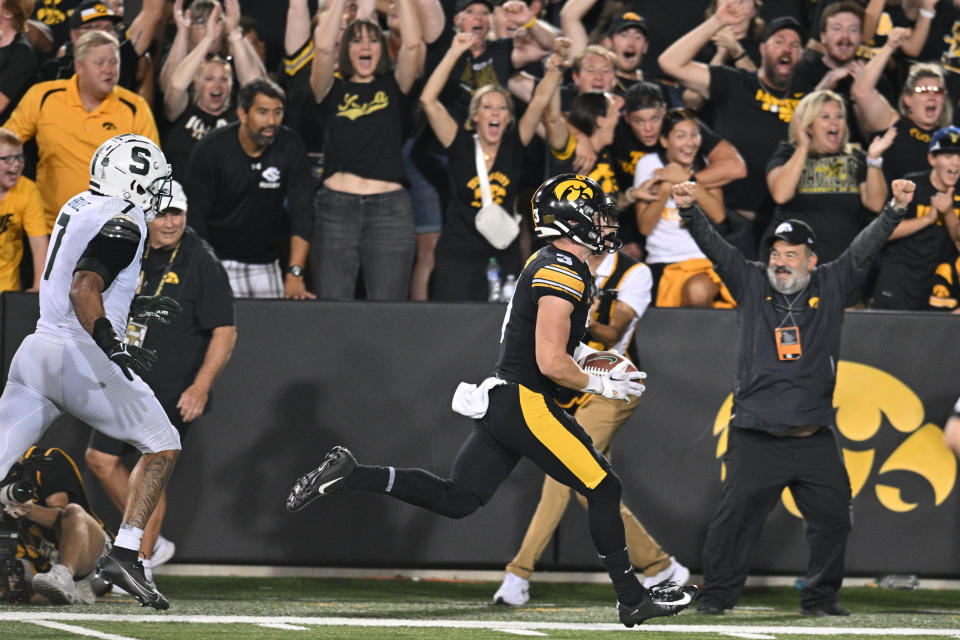 Sep 30, 2023; Iowa City, Iowa, USA; Iowa Hawkeyes defensive back Cooper DeJean (3) scores a touchdown on a punt return as Michigan State Spartans linebacker Aaron Brule (7) pursues during the fourth quarter at Kinnick Stadium. Mandatory Credit: Jeffrey Becker-USA TODAY Sports