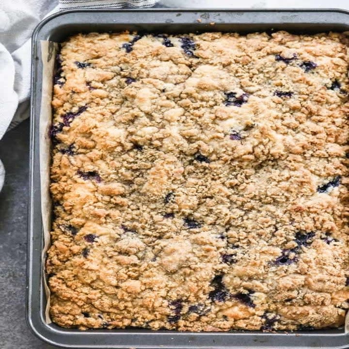 Blueberry coffee cake in a cake pan.