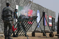 Chinese soldiers let off signal flares during the Shared Destiny 2021 drill at the Queshan Peacekeeping Operation training base in Queshan County in central China's Henan province Wednesday, Sept. 15, 2021. Peacekeeping troops from China, Thailand, Mongolia and Pakistan took part in the 10 days long exercise that field reconnaissance, armed escort, response to terrorist attacks, medical evacuation and epidemic control. (AP Photo/Ng Han Guan)