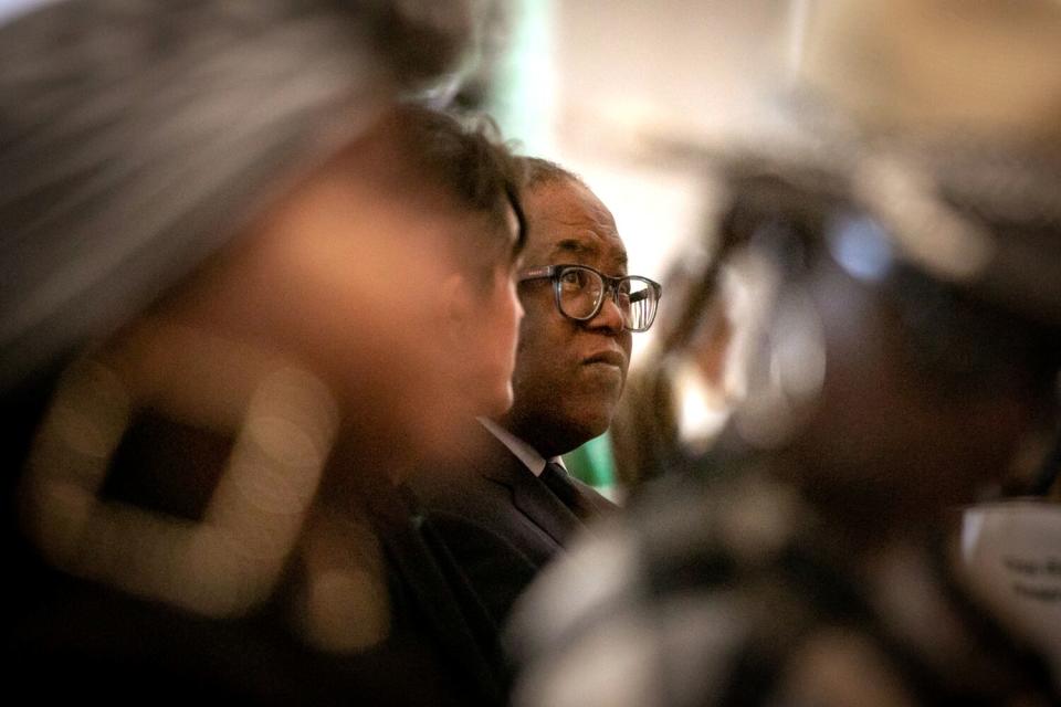 Mark Ridley-Thomas sits in the audience as community members and clergy across Los Angeles gather at a church to support him.