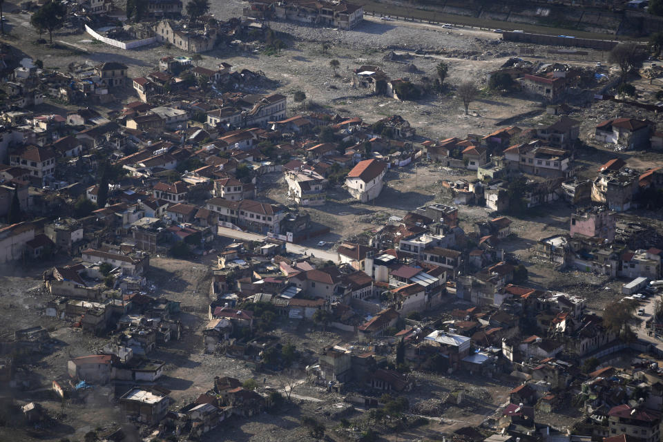 This Thursday, Jan. 11, 2024 photo shows an aerial view of the devastation a year after the powerful earthquake hit on Feb. 6, 2023 in the city of Antakya, southern Turkey. (AP Photo/Khalil Hamra)
