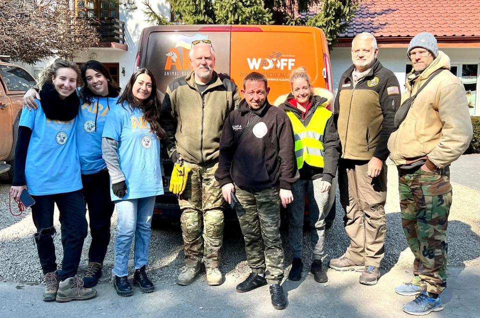 Mike Merrill (second from right) poses in Ukraine with animal rescuers who came to help from multiple other countries. Merrill founded a Jacksonville-based animal rescue.