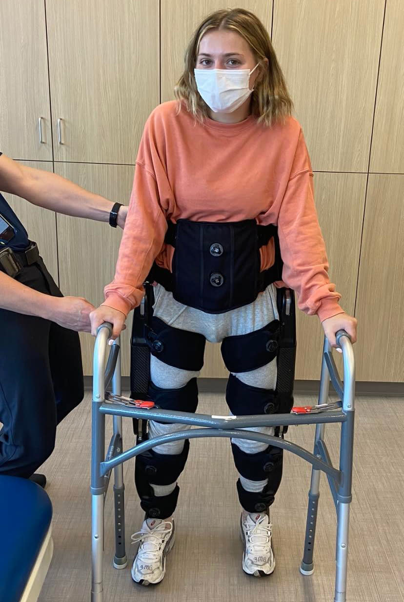 Ms Eckroth learning to stand again after her accident.