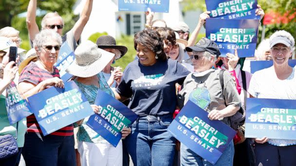 PHOTO: Senate candidate Cheri Beasley, center, laughs after posing for a photograph with voters near a polling place at Fearrington Village's The Gathering Place in Pittsboro, N.C., May 17, 2022.  (The Washington Post via Getty Images, FILE)