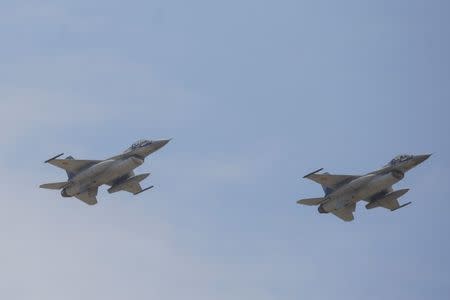 Two F-16 planes perform a fly-by in proximity of the 85th Air Base of the Romanian Air Force during the official presentation ceremony of 6 F-16 planes bought by the Romanian government, in Fetesti, Calarasi county, Romania October 7, 2016. Inquam Photos/Octav Ganea/via REUTERS