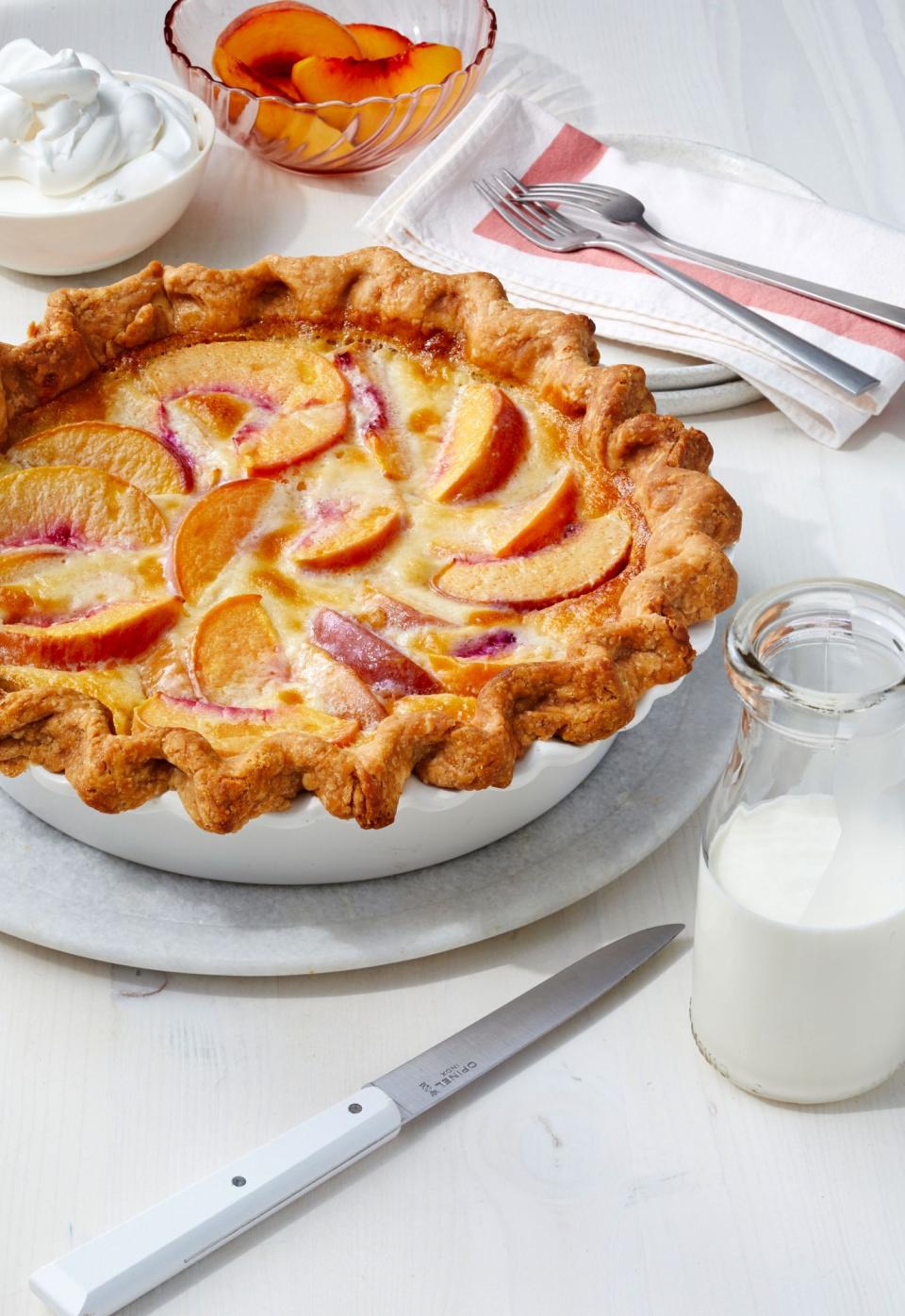 <p><strong>Recipe: </strong><a href="https://www.southernliving.com/recipes/peach-custard-pie" rel="nofollow noopener" target="_blank" data-ylk="slk:Peach Custard Pie;elm:context_link;itc:0;sec:content-canvas" class="link "><strong>Peach Custard Pie</strong></a></p> <p>This recipe from our July 2020 issue combines the best of creamy old-school pies with fresh summer peaches. It’s easy and beautiful, which makes it ideal for simple summer gatherings. One reader said it’s “easy and absolutely delicious.”</p>