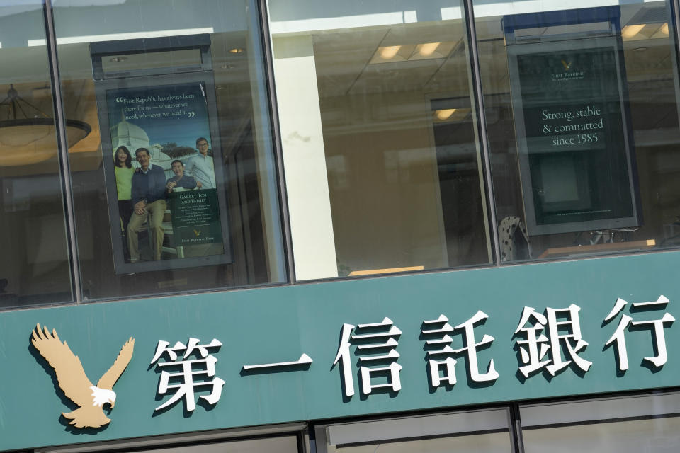 The First Republic Bank logo is seen at Chinatown branch of the bank, Thursday, March 16, 2023 in New York. The S&P 500 was 0.8% higher in midday trading after erasing an earlier loss of nearly that much following reports that First Republic Bank could receive financial assistance or sell itself to another bank. (AP Photo/Mary Altaffer)