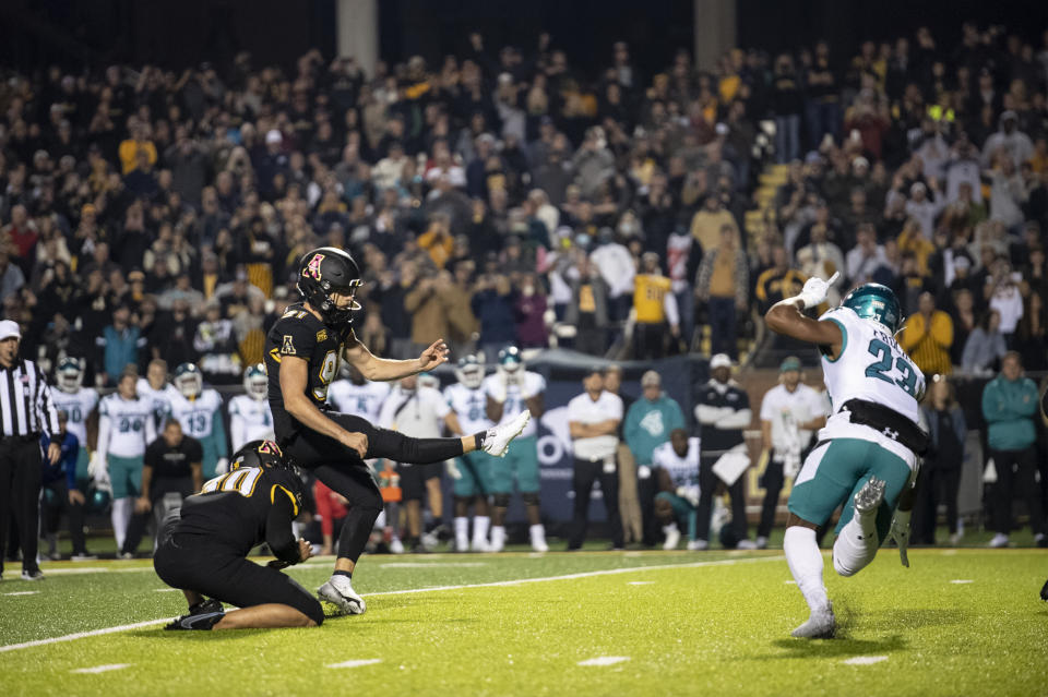 Appalachian State place kicker Chandler Staton (91) kicks a game winning field goal during the second half of an NCAA college football game against Coastal Carolina on Wednesday, Oct. 20, 2021, in Boone, N.C. (AP Photo/Matt Kelley)