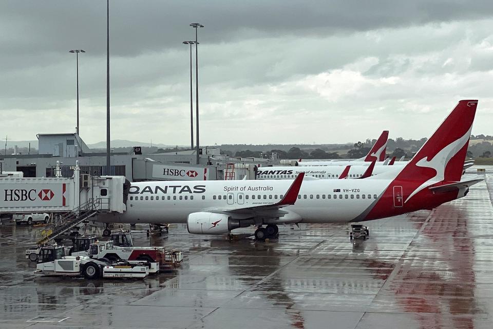 <p>Qantas planes lined up at Melbourne's international airport</p> (AFP via Getty Images)