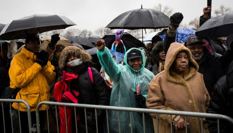 Demonstrators protest during a rally following the "We Shall not be Moved" march organized by the National Action Network January 14, 2017 in Washington, D.C