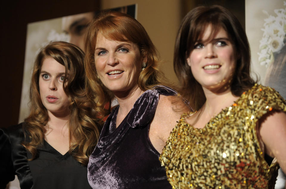 FILE - Sarah Ferguson, Duchess of York, center, a producer of the film "The Young Victoria," poses with her daughters Princess Beatrice of York, left, and Princess Eugenie of York at the premiere of the film in Los Angeles, Thursday, Dec. 3, 2009, in Los Angeles. Sarah, the Duchess of York, underwent surgery following a breast cancer diagnosis, according to a spokesperson. The 63-year-old was diagnosed with early-stage breast cancer following a routine mammogram. The surgery was successful and Sarah’s doctors told her the prognosis is good, the duchess’s spokesperson said on Sunday, June 25 2023. (AP Photo/Chris Pizzello, File)