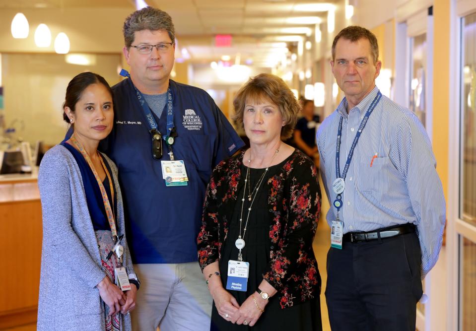 Four Children's Hospital of Wisconsin doctors, from left, Louella Amos, a pulmonologist; Micheal Meyer, medical director of the Pediatric Intensive Care Unit; Lynn D'Andrea, medical director of pulmonary services; and Michael Gutzeit, chief medical officer, were among the first to make the connection between vaping and an outbreak of severe lung injuries. The doctors are seen here Monday, Sept. 16, 2019, in the Pediatric Intensive Care Unit.