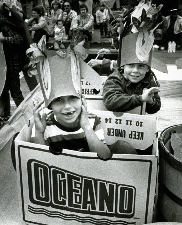 Arroyo Grande residents James Schneider, 5, and Katie Spierling, 4 1/2, ride on a produce-themed float during the Harvest Festival parade in Arroyo Grande in 1988.