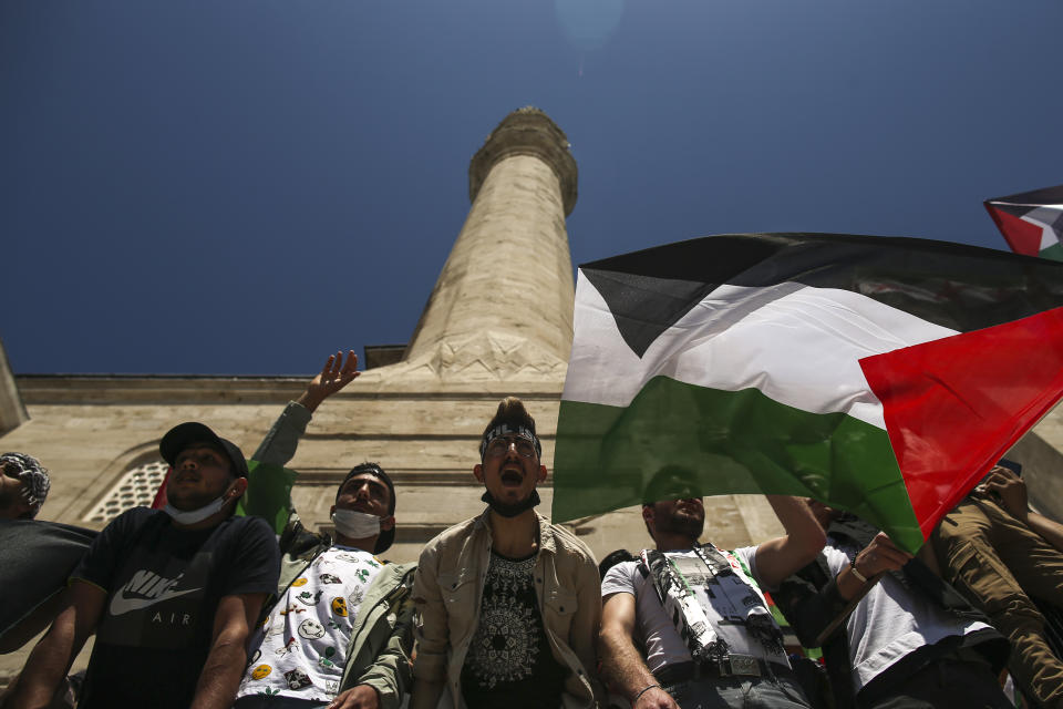 Protesters chant anti-Israel slogans during a rally outside Fatih mosque in Istanbul following Friday prayers, Friday, May 4, 2021, in support of Palestinians, killed in the recent escalation of violence in Jerusalem and the Gaza Strip. People in Turkey have been demonstrating against Israel this week and have gathered without much interference from the police despite a strict lockdown to curb COVID-19 infections that have ordered people to stay home until May 17.(AP Photo/Emrah Gurel)