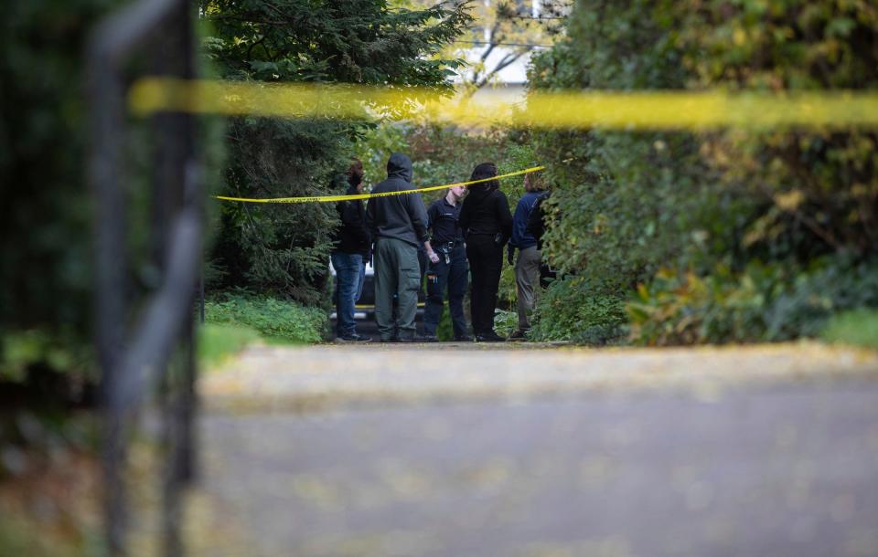 Law enforcement officers stand near the scene where a Detroit synagogue president, Samantha Woll, was found dead in Detroit on Saturday, Oct. 21, 2023.