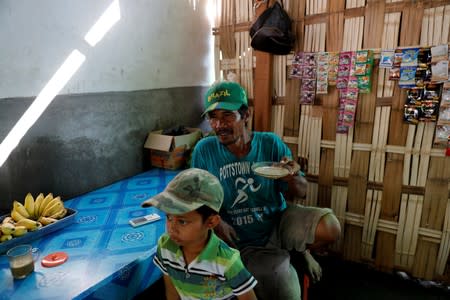 The Wider Image: Cash for trash: Indonesia village banks on waste recycling