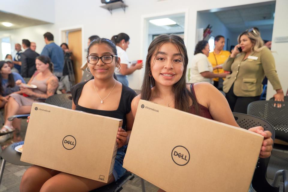 Dozens of Holland area students involved in Latin Americans United for Progress received laptops from Comcast this week in an effort to “bridge the digital divide.”