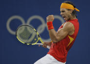 FILE - Rafael Nadal of Spain reacts to winning a point against Fernando Gonzalez of Chile during their Gold medal singles tennis match at the Beijing 2008 Olympics in Beijing, in this Sunday, Aug. 17, 2008, file photo. Nadal will not be participating in the Tokyo Games. (AP Photo/Elise Amendola, File)