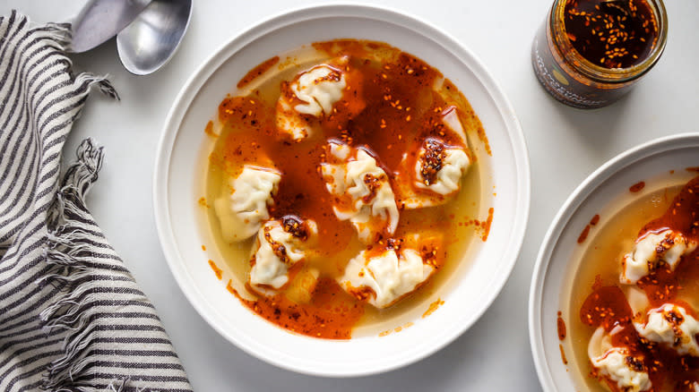 dumpling soup in white bowls