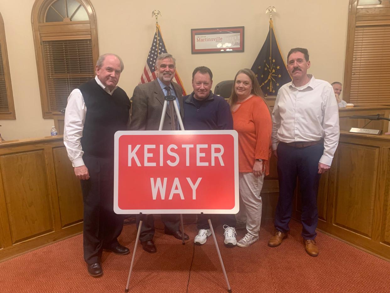 From left, Martinsville Superintendent Mac Dunn, Mayor Kenny Costin and members of the Keister family pose for a photo in Common Council chambers. A portion of a new road in Martinsville will be named after David Keister, founder of WCBK radio station.