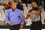 Houston head coach Kelvin Sampson, left, reacts after speaking with an official during the second half of an NCAA college basketball game against Texas Tech, Sunday, Nov. 29, 2020, in Fort Worth, Texas. (AP Photo/Ron Jenkins)