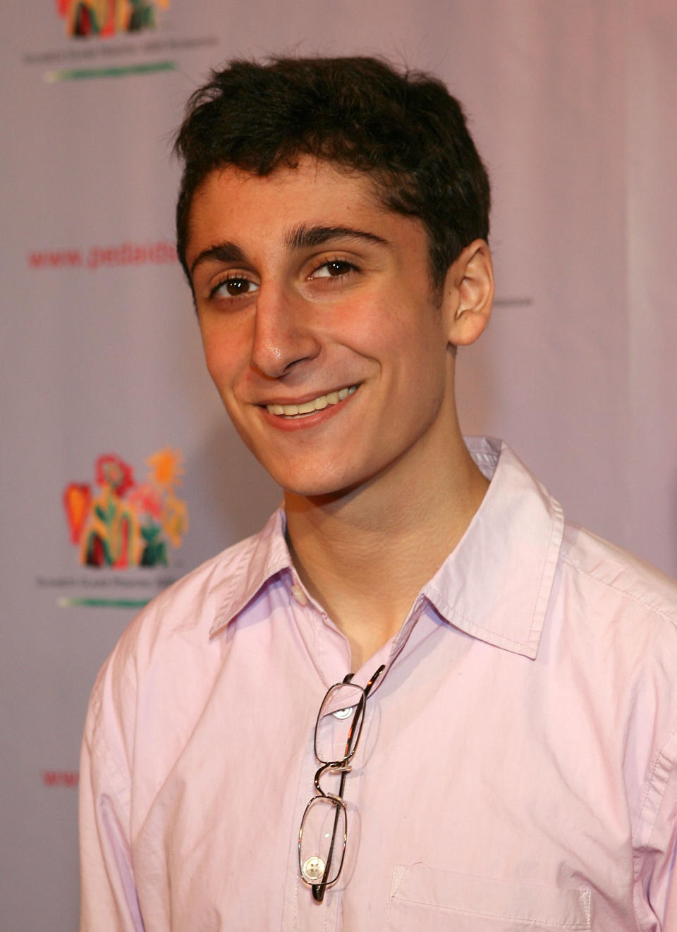 Close-up of Daniel smiling at a media event