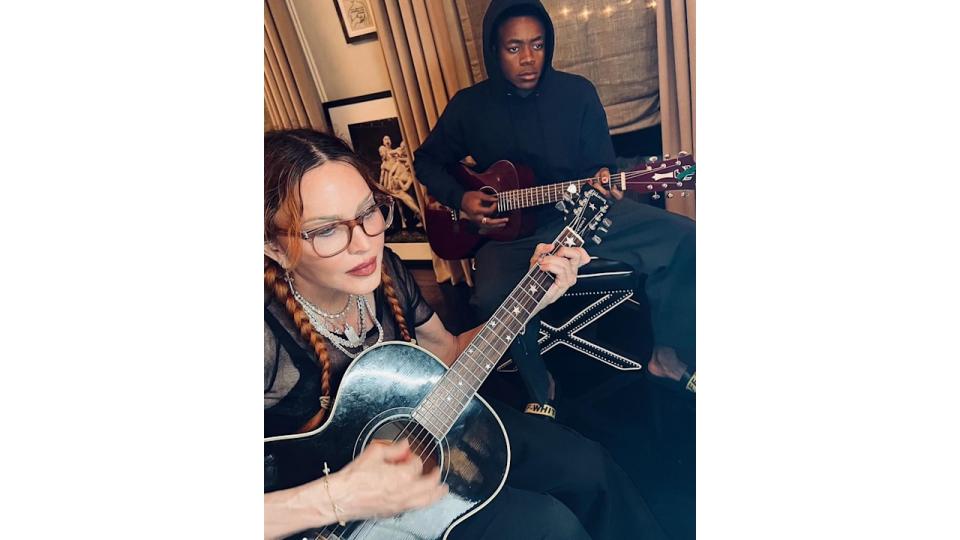 madonna and david banda playing guitar