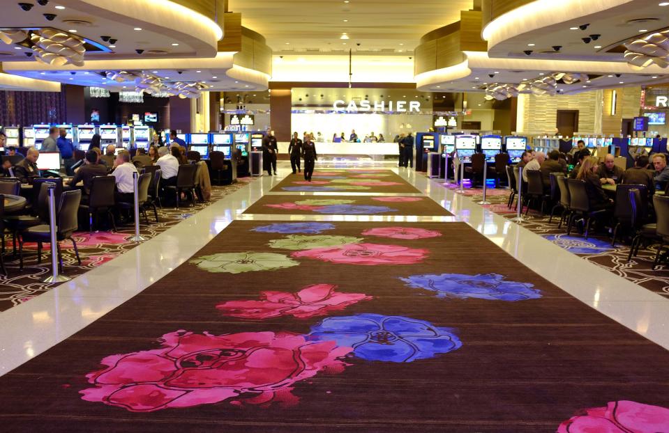 FILE - People gamble inside Graton Resort and Casino in Rohnert Park, Calif., Oct. 29, 2013. The campaign that could bring legalized sports betting to California has become the most expensive ballot initiative fight in state history. Two rival proposals are pitting wealthy Native American tribes against FanDuel, DraftKings and other online gambling companies, in a contest over what could become the nation's most lucrative marketplace. (AP Photo/Eric Risberg, File)