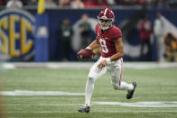 Alabama quarterback Bryce Young (9) runs against Georgia during the first half of the Southeastern Conference championship NCAA college football game, Saturday, Dec. 4, 2021, in Atlanta. (AP Photo/Brynn Anderson)