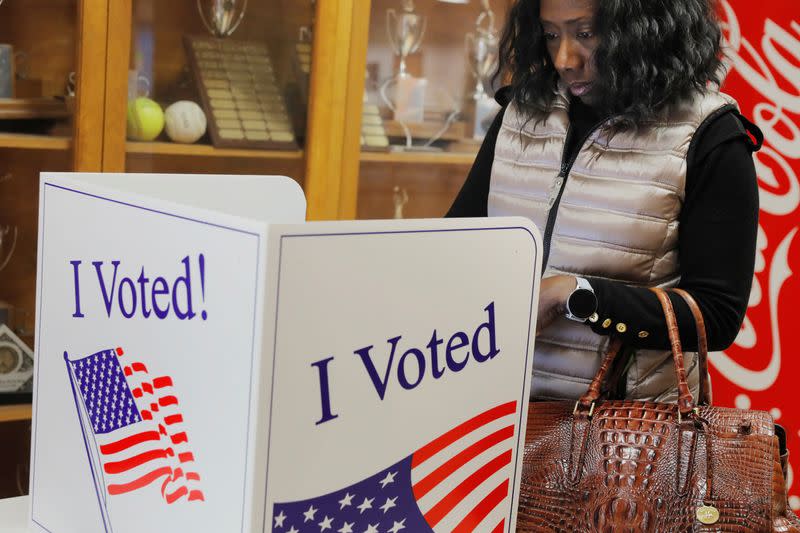 A woman casts her ballot at a polling station for the South Carolina primary in Indian Land South Carolina