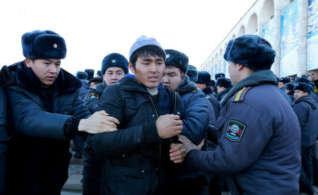 Police officers detain protester against the rising Chinese presence in the country in Bishkek, Kyrgyzstan, January 17, 2019. REUTERS/Stringer