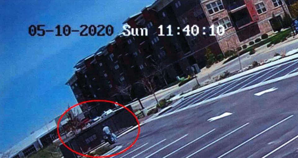 On May 10, 2020, the day Suzanne Morphew is reported missing, investigators discovered Barry Morphew threw out trash at multiple locations around Broomfield, Colorado, while in town for work. This photo, taken from hotel surveillance footage, shows Barry throwing out trash in a dumpster. He told investigators he often dropped trash in accessible bins to avoid paying to have it disposed of at a landfill. Investigators, however, believe Barry was disposing of evidence. / Credit: Chaffee County District Court