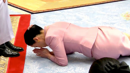 King Maha Vajiralongkorn and his consort, General Suthida Vajiralongkorn named Queen Suthida, attend their wedding ceremony in Bangkok, Thailand May 1, 2019, in this screen grab taken from a video. Thai TV Pool