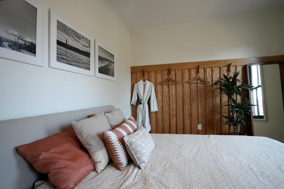 A guest bedroom boasts photos taken by Barrett.