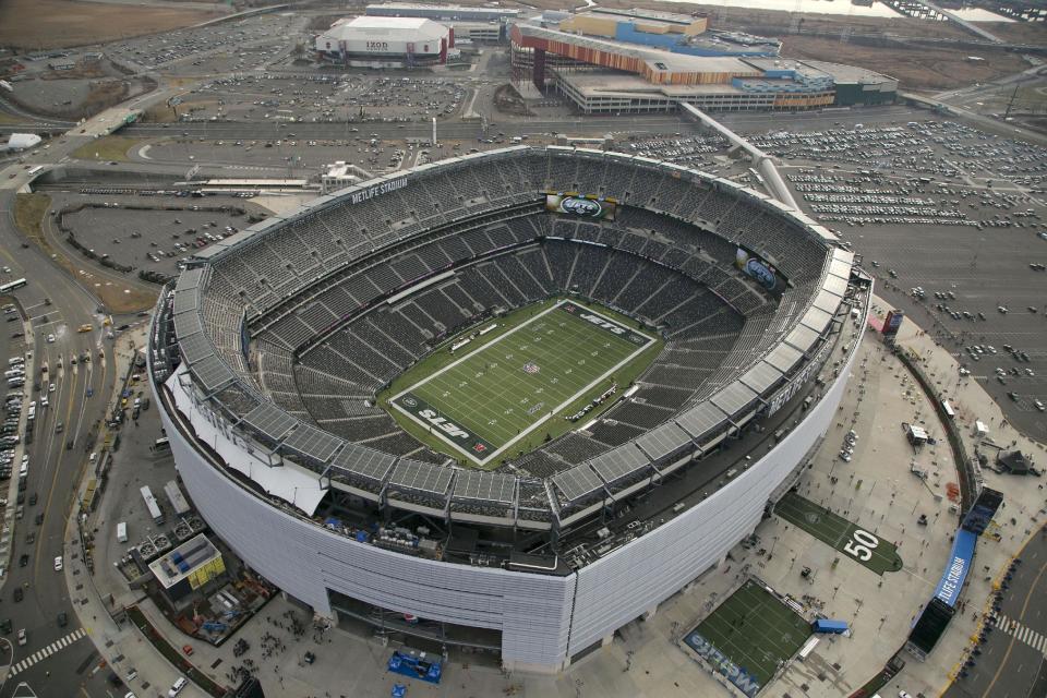 In this Dec. 1, 2013, photo, MetLife Stadium is seen in an aerial photo in East Rutherford, N.J. Super Bowl tickets are tough to acquire. There's only so many seats in the stadium, and several are filled by corporations and sponsors. Then, when you factor in price and logistics, it makes it all that more difficult, even with the rise of the secondary market on the internet. Things won't be any easier this year, as the NFL houses its first cold-weather Super Bowl on Feb. 2 at MetLife Stadium with the New York skyline as a backdrop. (AP Photo/Mark Lennihan)