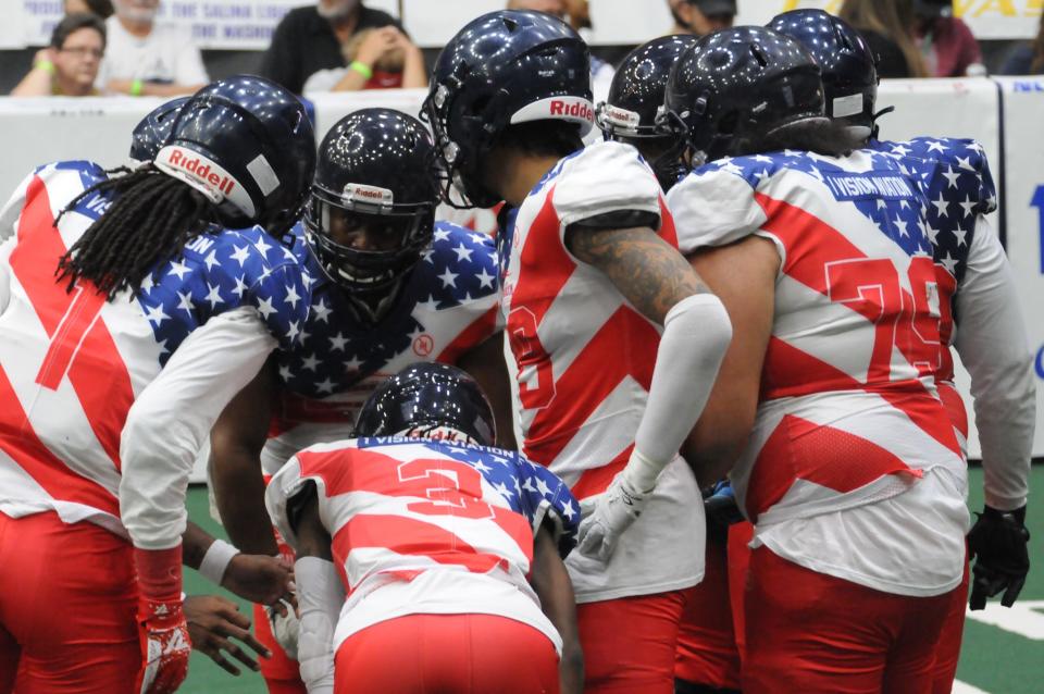 The Salina Liberty offense huddles during Champions Bowl VII against the Omaha Beef Saturday, June 25, 2022 at Tony's Pizza Events Center. The Liberty claimed its first Champions Bowl with a 38-34 victory over the Beef.