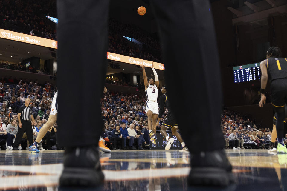 Virginia's Armaan Franklin (4) shoots against Albany during the second half of an NCAA college basketball game in Charlottesville, Va., Wednesday, Dec. 28, 2022. (AP Photo/Mike Kropf)