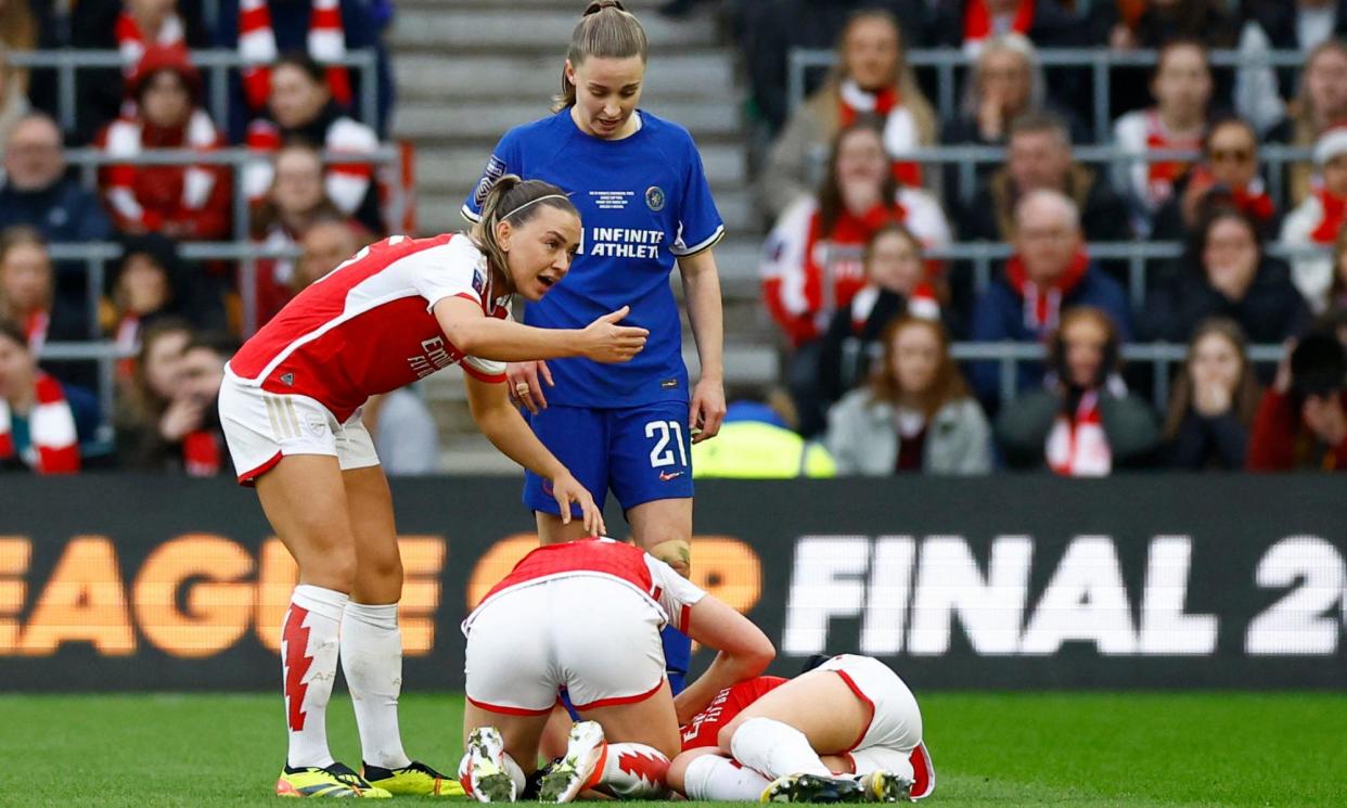 <span>Arsenal's Katie McCabe gestures for medical assistance for Frida Maanum.</span><span>Photograph: Peter Cziborra/Action Images/Reuters</span>