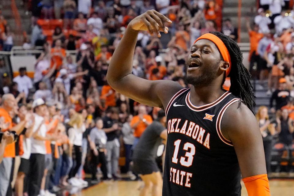 OSU guard Isaac Likekele gestures to fans after  his final game as a Cowboy. He transferred to Ohio State.