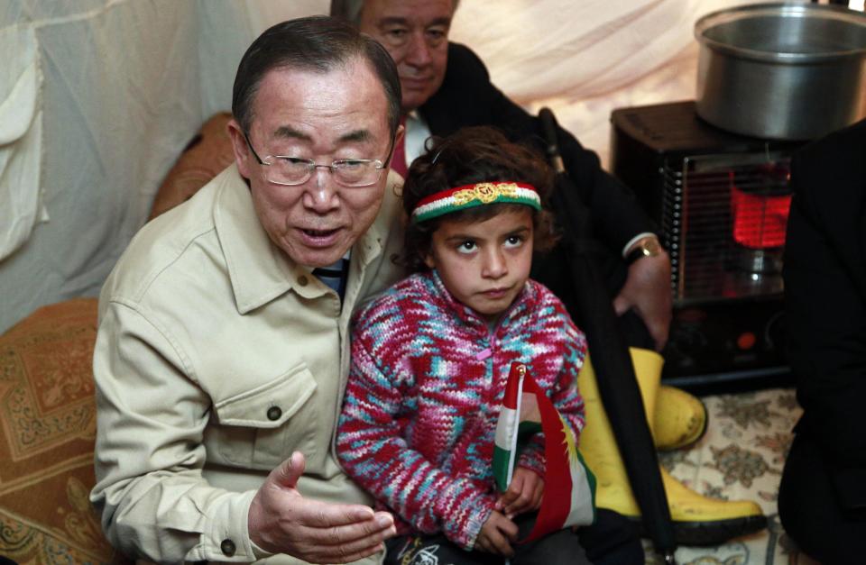 United Nations Secretary-General Ban Ki-Moon sits inside a tent belonging to a Syrian refugee family at a refugee camp in Irbil, 217 miles (350 kilometers) north of Baghdad, Iraq, Tuesday, Jan. 14, 2014. He expressed his deep sadness over the suffering and the hard conditions the refugees are living in. “I am particularly saddened to see so many young children and women and vulnerable groups who suffer from this man-made tragedy,” he added. The Syrian conflict began in March 2011 with largely peaceful protests against Bashar Assad before shifting into an armed insurgency after a brutal government crackdown. It has killed more than 120,000 people, forced more than 2 million to flee the country and devastated the nation's cities, economy and social fabric.(AP Photo)